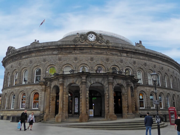 The round stone building of the Corn Exchange in the sunshine in Leeds.