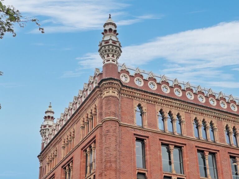 St Paul's House, constructed out of decorative pink brick, with its towers and minarets in the sunshine.